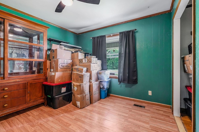 storage room with visible vents and ceiling fan
