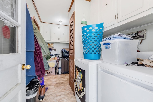 laundry room with cabinet space and washer and dryer