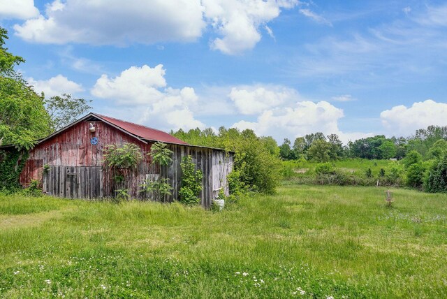 exterior space featuring a barn and an outdoor structure