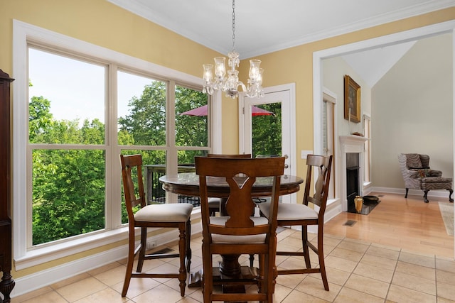 7237 River Run Dr, Chattanooga, TN 37416 - dining room featuring light tile patterned floors, baseboards, an inviting chandelier, and a wealth of natural light