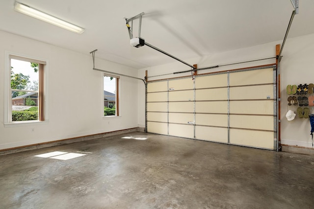 7237 River Run Dr, Chattanooga, TN 37416 - garage featuring baseboards and a garage door opener