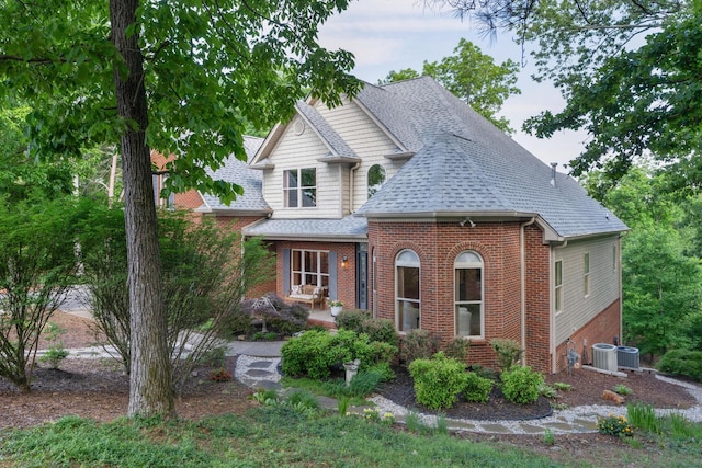 7237 River Run Dr, Chattanooga, TN 37416 - view of front facade featuring central air condition unit, brick siding, and a shingled roof