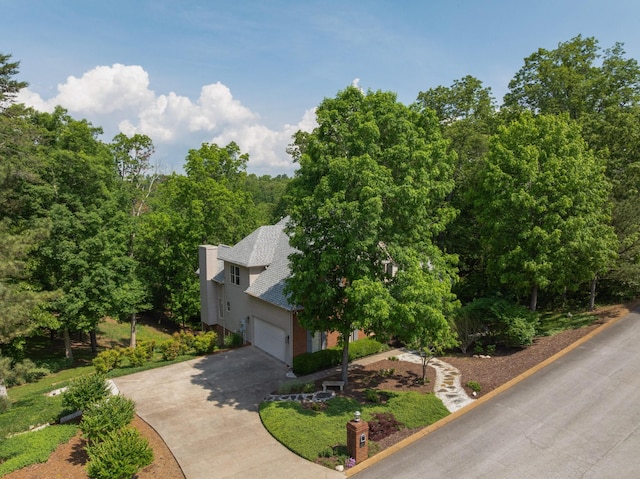 7237 River Run Dr, Chattanooga, TN 37416 - view of property exterior featuring a garage, driveway, and a shingled roof