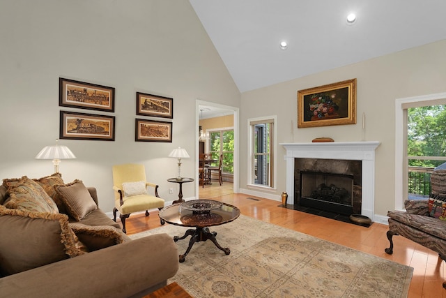 7237 River Run Dr, Chattanooga, TN 37416 - living room featuring hardwood / wood-style floors, a fireplace, baseboards, high vaulted ceiling, and recessed lighting