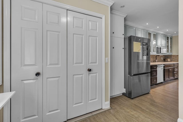 120 Tanasi Shr, Gallatin, TN 37066 - kitchen with light countertops, appliances with stainless steel finishes, light wood-type flooring, and glass insert cabinets