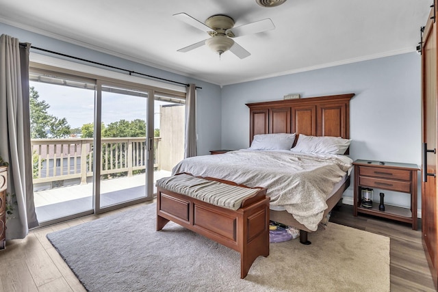 120 Tanasi Shr, Gallatin, TN 37066 - bedroom featuring crown molding, a barn door, wood finished floors, and access to exterior