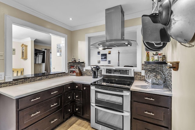 120 Tanasi Shr, Gallatin, TN 37066 - kitchen with light countertops, range with two ovens, and island range hood