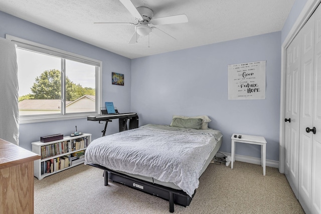 120 Tanasi Shr, Gallatin, TN 37066 - bedroom featuring a ceiling fan, a closet, carpet flooring, and a textured ceiling