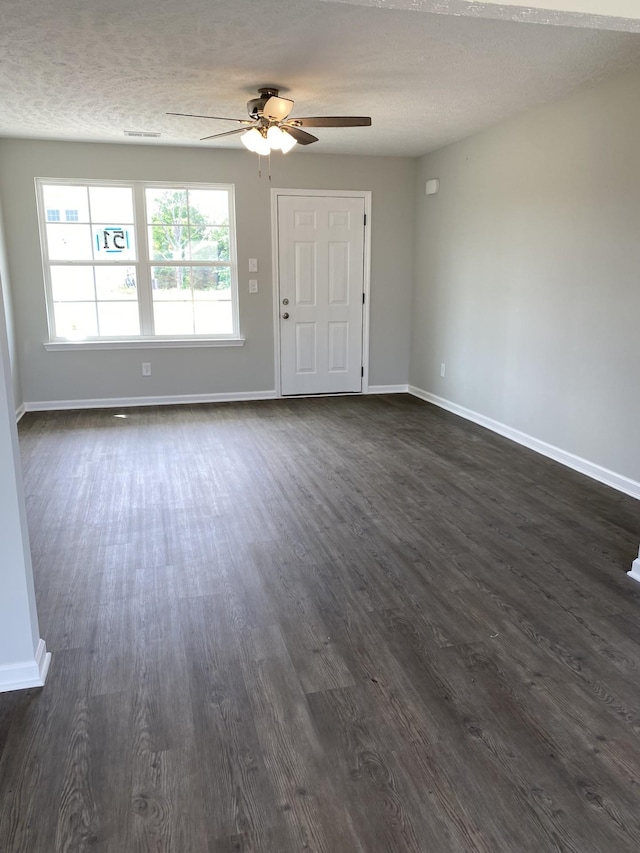1110 Merritt Hill Trl, Smyrna, TN 37167 - unfurnished living room with ceiling fan, baseboards, and dark wood-type flooring