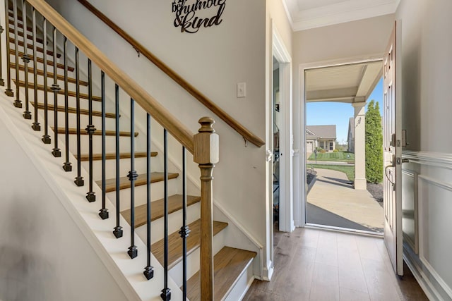 1235 Del Webb Blvd, Spring Hill, TN 37174 - foyer entrance with crown molding, stairs, and dark wood-type flooring