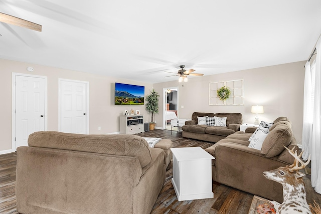 140 Keele Rd, Manchester, TN 37355 - living room featuring a ceiling fan, dark wood-style flooring, and baseboards