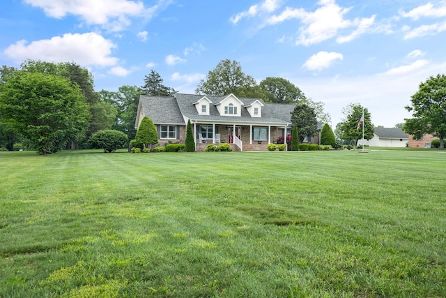 140 Keele Rd, Manchester, TN 37355 - cape cod-style house with covered porch and a front yard