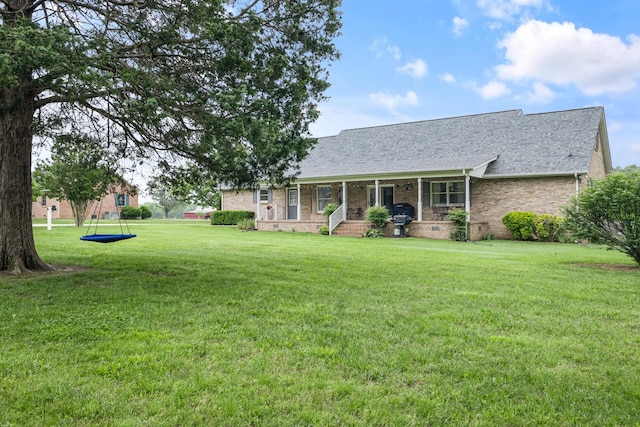 140 Keele Rd, Manchester, TN 37355 - view of front of property with a front lawn, a shingled roof, brick siding, and covered porch
