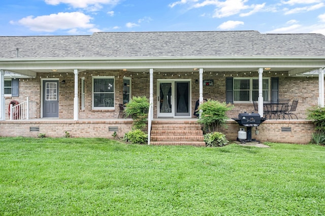 140 Keele Rd, Manchester, TN 37355 - view of front of home featuring covered porch, crawl space, a front lawn, and brick siding