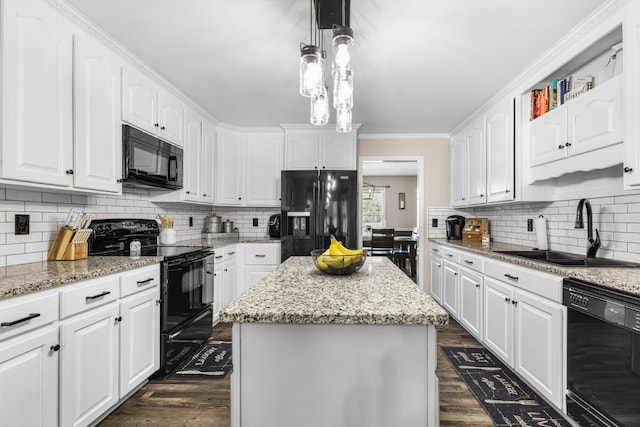 140 Keele Rd, Manchester, TN 37355 - kitchen with black appliances, a sink, dark wood-style flooring, white cabinetry, and tasteful backsplash