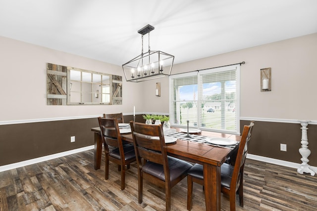140 Keele Rd, Manchester, TN 37355 - dining area with wood finished floors, a chandelier, and baseboards