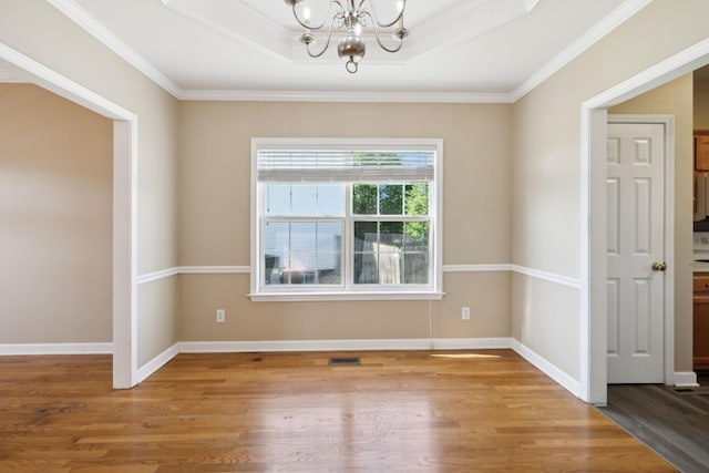 1030 Persimmon Dr, Spring Hill, TN 37174 - spare room with a chandelier, wood finished floors, ornamental molding, and baseboards