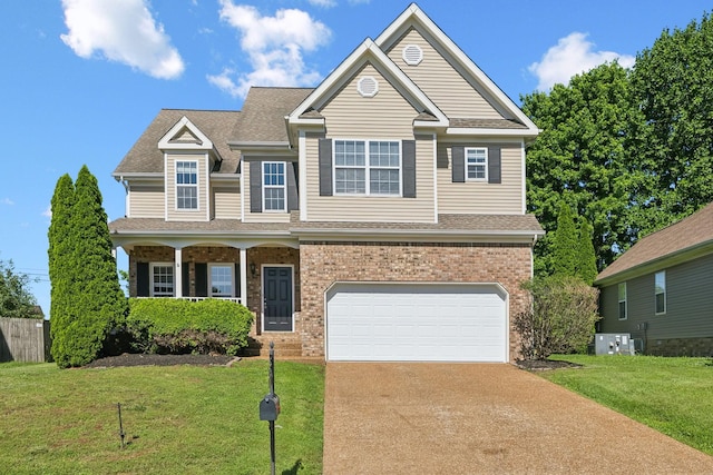 1030 Persimmon Dr, Spring Hill, TN 37174 - view of front of property featuring driveway, a garage, a front yard, and brick siding