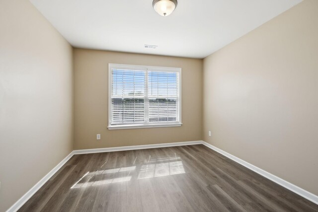 1030 Persimmon Dr, Spring Hill, TN 37174 - unfurnished room featuring dark wood-type flooring and baseboards