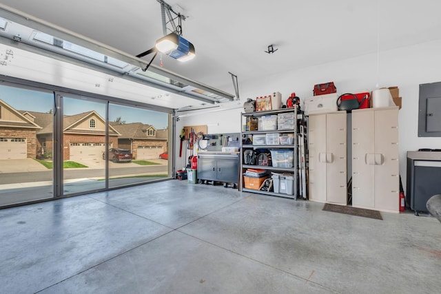 garage featuring a garage door opener and electric panel