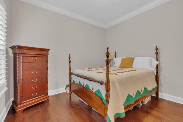 bedroom with crown molding, baseboards, and hardwood / wood-style flooring