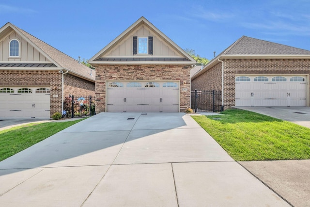 view of front of house featuring a garage, a front yard, stone siding, board and batten siding, and concrete driveway