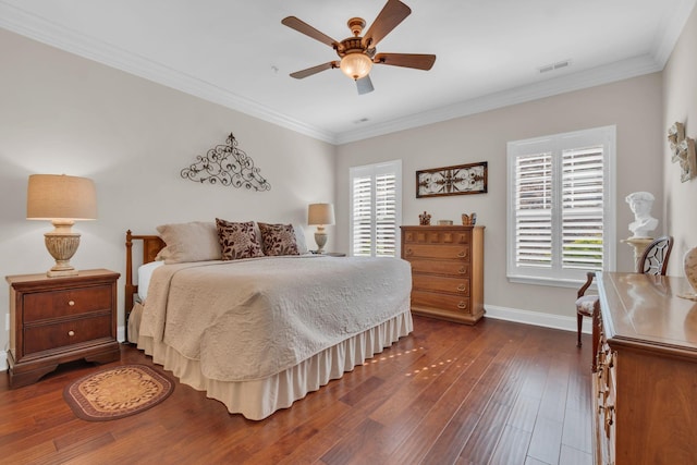 bedroom featuring visible vents, ornamental molding, baseboards, and dark wood-type flooring