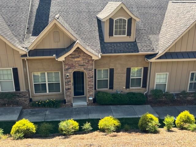 100 Placid Grove Ln Unit 2002, Goodlettsville, TN 37072 - view of front of property featuring board and batten siding, stone siding, and roof with shingles