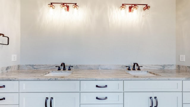 full bathroom featuring a sink and double vanity