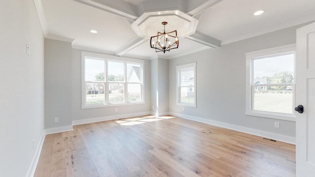 unfurnished dining area with baseboards, light wood-type flooring, a notable chandelier, and visible vents