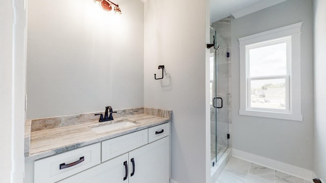 full bathroom with vanity, baseboards, a stall shower, and marble finish floor