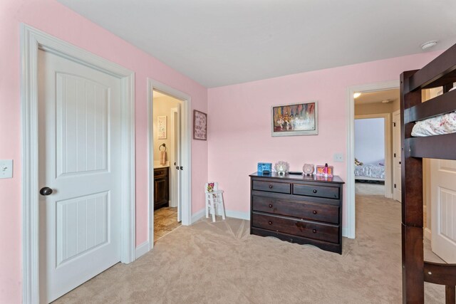 carpeted bedroom with baseboards