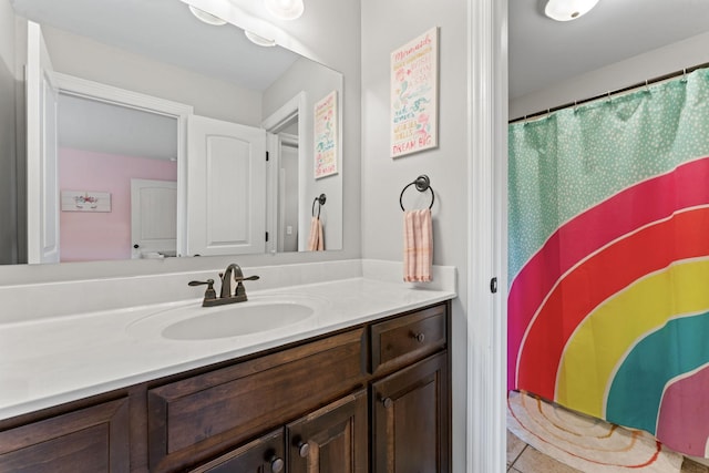 full bathroom with tile patterned flooring and vanity