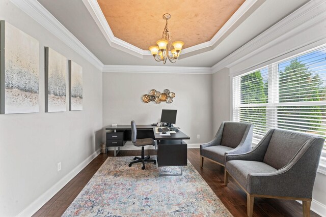 office with a raised ceiling, baseboards, a chandelier, ornamental molding, and dark wood-type flooring