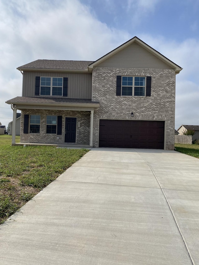 103 Glentree Cv, Smyrna, TN 37167 - traditional-style house featuring a garage, concrete driveway, brick siding, a front yard, and board and batten siding