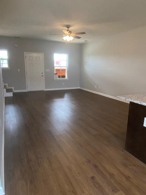 103 Glentree Cv, Smyrna, TN 37167 - empty room with baseboards, dark wood-style flooring, and ceiling fan