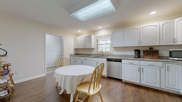 1213 Shackelford Dr, Mount Pleasant, TN 38474 - kitchen with crown molding, white cabinets, a sink, dark wood finished floors, and appliances with stainless steel finishes