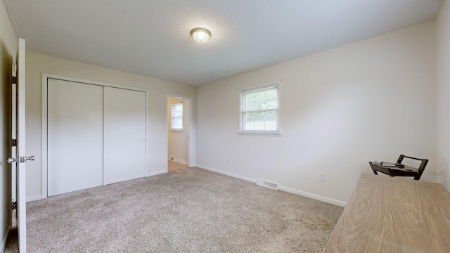 1213 Shackelford Dr, Mount Pleasant, TN 38474 - unfurnished bedroom featuring visible vents, carpet, baseboards, and a closet