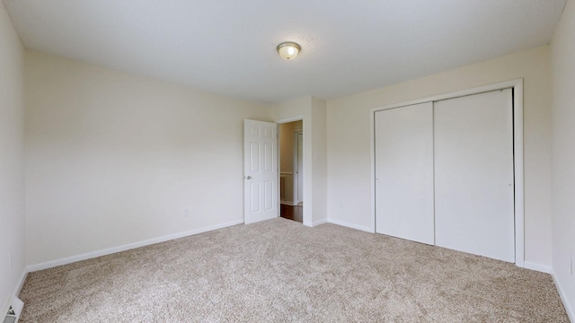 1213 Shackelford Dr, Mount Pleasant, TN 38474 - unfurnished bedroom featuring carpet floors, baseboards, and a closet