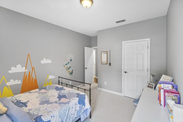 carpeted bedroom with visible vents and baseboards