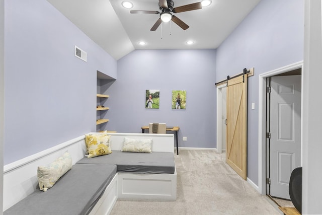 bedroom featuring light colored carpet, visible vents, a barn door, baseboards, and recessed lighting