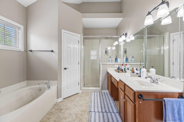 full bath with vanity, a garden tub, tile patterned flooring, baseboards, and a stall shower