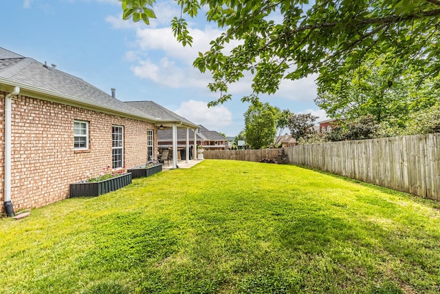 view of yard featuring a fenced backyard and a patio area
