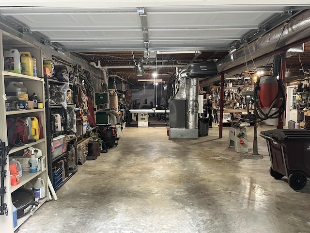 319 Powder Mill Dr, Ashland City, TN 37015 - garage featuring heating unit and a workshop area