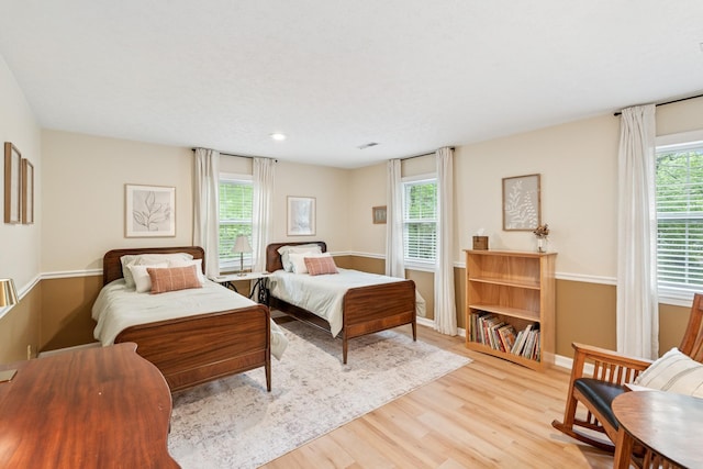 319 Powder Mill Dr, Ashland City, TN 37015 - bedroom with baseboards, multiple windows, and light wood finished floors