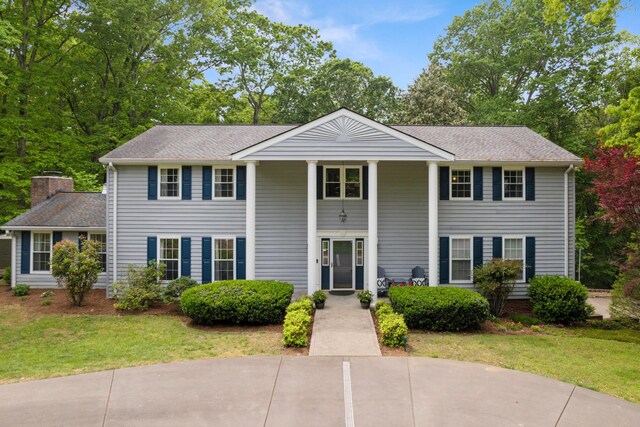 319 Powder Mill Dr, Ashland City, TN 37015 - neoclassical / greek revival house with a shingled roof and a front yard