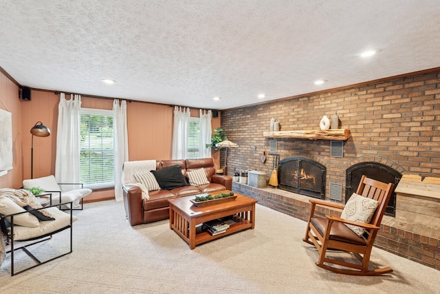 319 Powder Mill Dr, Ashland City, TN 37015 - carpeted living room with a textured ceiling, a healthy amount of sunlight, and a fireplace