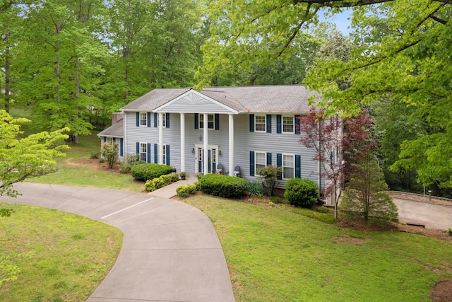 319 Powder Mill Dr, Ashland City, TN 37015 - neoclassical / greek revival house with driveway and a front lawn