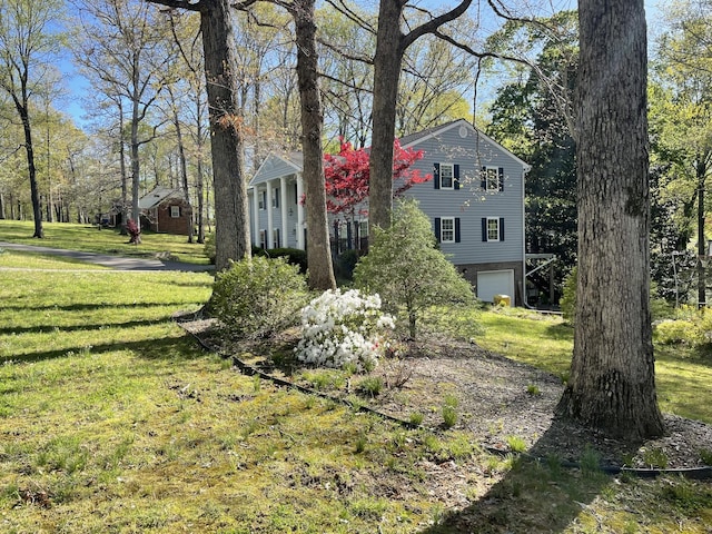 319 Powder Mill Dr, Ashland City, TN 37015 - view of front of home featuring a garage and a front yard