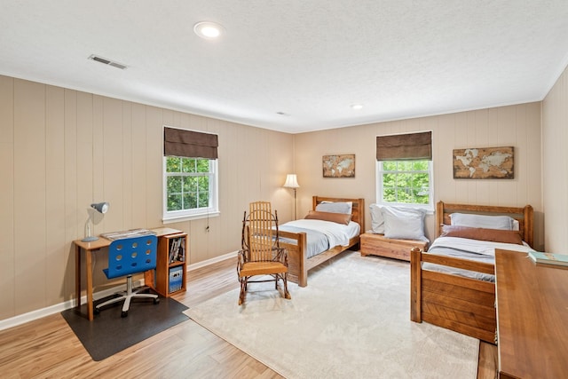 319 Powder Mill Dr, Ashland City, TN 37015 - bedroom with baseboards, visible vents, multiple windows, and light wood-style floors